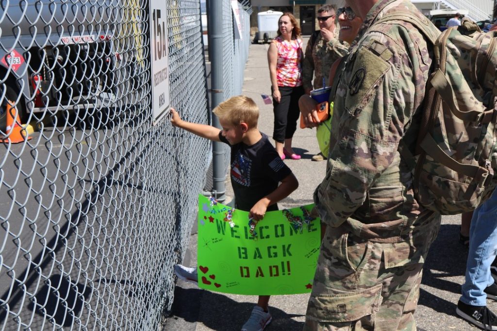 On August 3, 2022, families await soldiers from the Montana National Guard's 1063rd Maintenance Company who returned after nearly a year away from family, friends and home. (Photo: Montana National Guard)