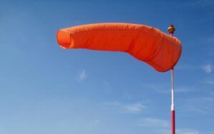 windsock, bright, orange, blue sky, air sleeve, air sock, wind cone, red, white, pole, wind, blowing, windsock, windsock, windsock, windsock, windsock