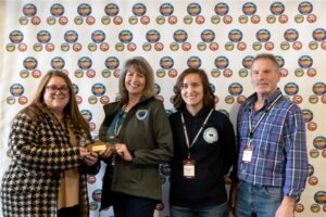 Rod and Lisa Cline, owners of Cut Bank Marketplace on Main, and store manager Jacey Hannon win the 2025 Retailer of the Year Award at the Made in Montana Trade Show in Helena.