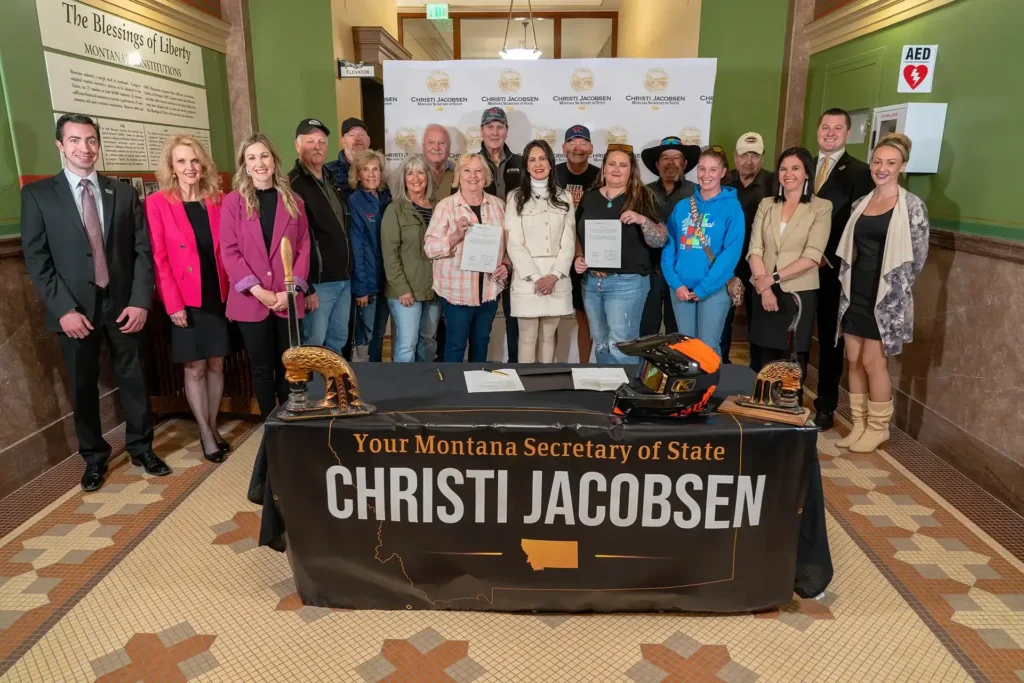 Members of the Montana Snowmobile Association and Secretary of State Christi Jacobsen.