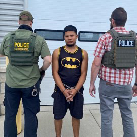 Homeland Security Investigations agents conduct an arrest operation