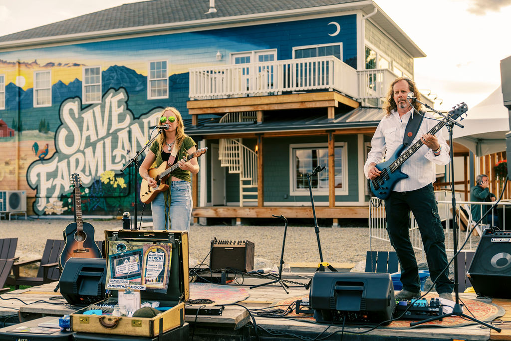 Musicians perform at the 2024 Whitefish Food & Wine Festival at Haskill Creek Farms
