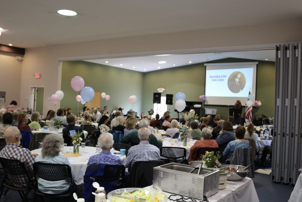 Attendees enjoy dinner while international recording artist Linda Lanier speaks during the "Celebrate Life MT" fundraiser