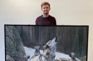 Man Showcases Wolf Family Painting