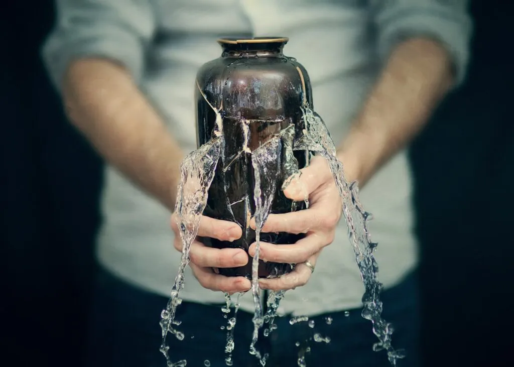 Cracked Vase with Water Leaking