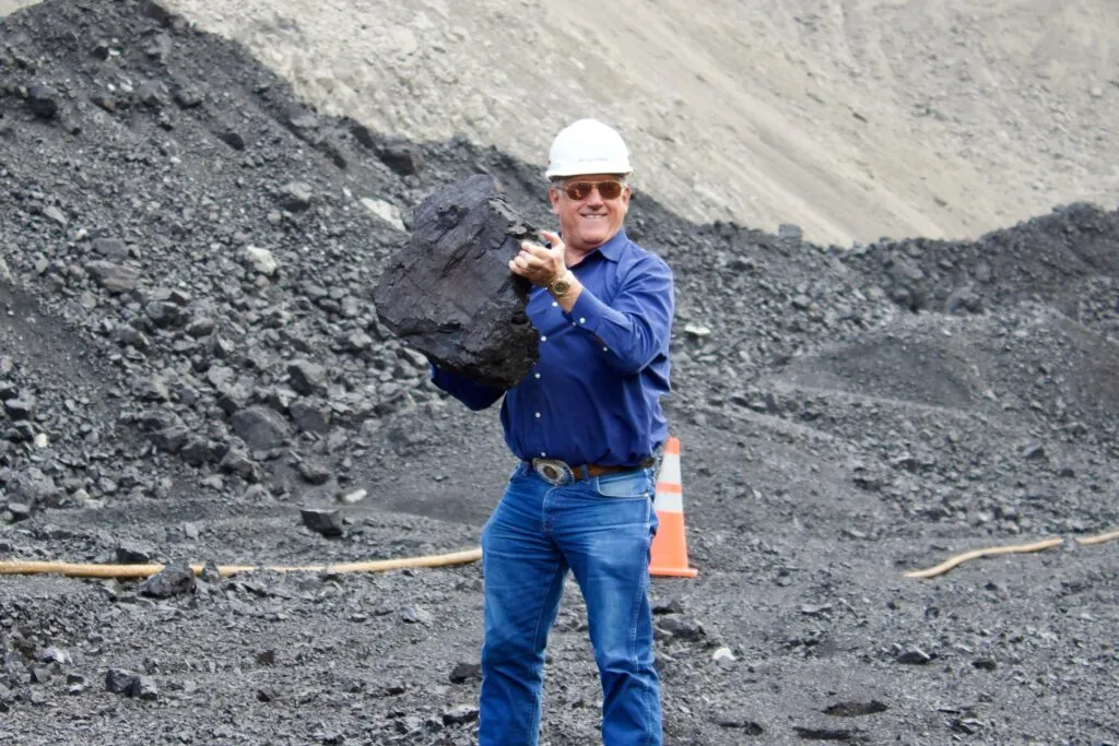 Rep. Troy Downing holds a large piece of coal during a visit to a Montana mine. (Courtesy photo)