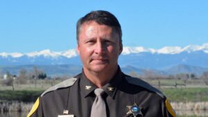 Sheriff Portrait with Mountain Backdrop