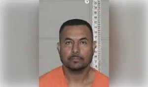 Mugshot Portrait: Inmate in Orange Jumpsuit