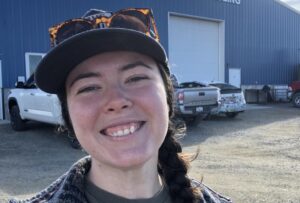 Outdoor Smiling Portrait in Front of Industrial Warehouse