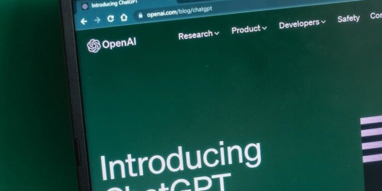 Laptop screen displaying the introductory page of ChatGPT on OpenAI's website.