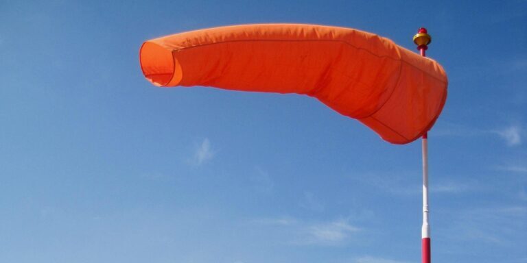 windsock, bright, orange, blue sky, air sleeve, air sock, wind cone, red, white, pole, wind, blowing, windsock, windsock, windsock, windsock, windsock