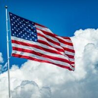 Photo by chris robert The US Flag flying high in the sky