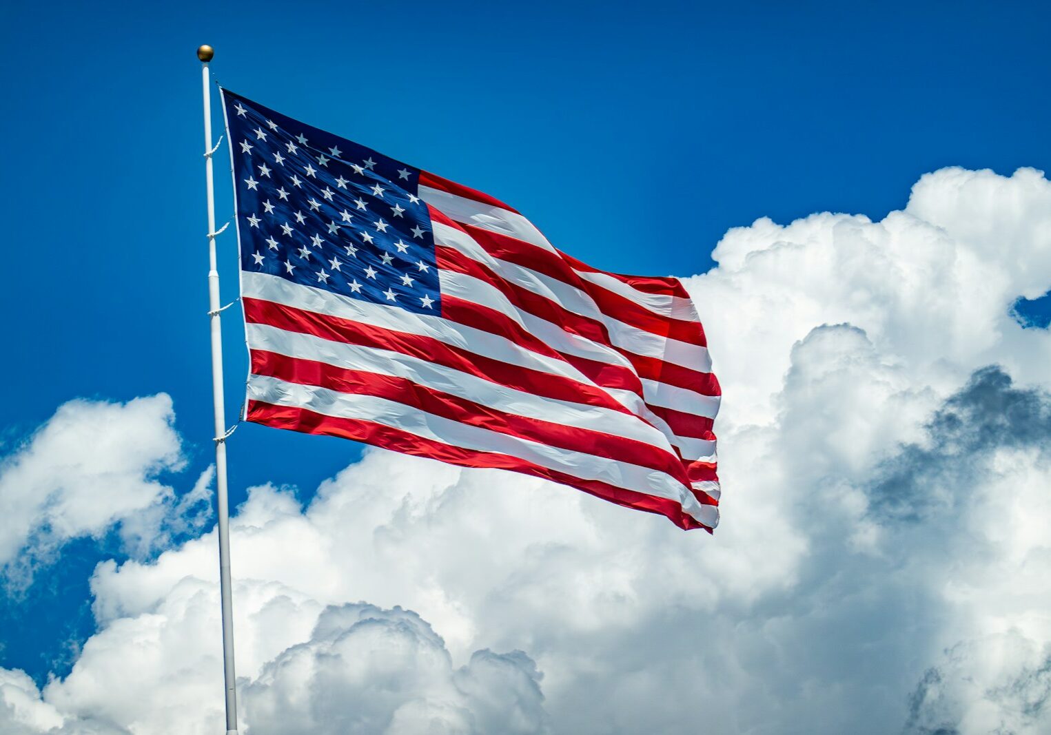 Photo by chris robert The US Flag flying high in the sky