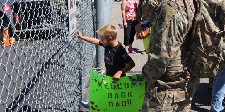 On August 3, 2022, families await soldiers from the Montana National Guard's 1063rd Maintenance Company who returned after nearly a year away from family, friends and home. (Photo: Montana National Guard)