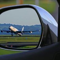 Photo by Pixabay A jet airplane taking off is reflected in a car's side mirror, capturing a unique aviation perspective.