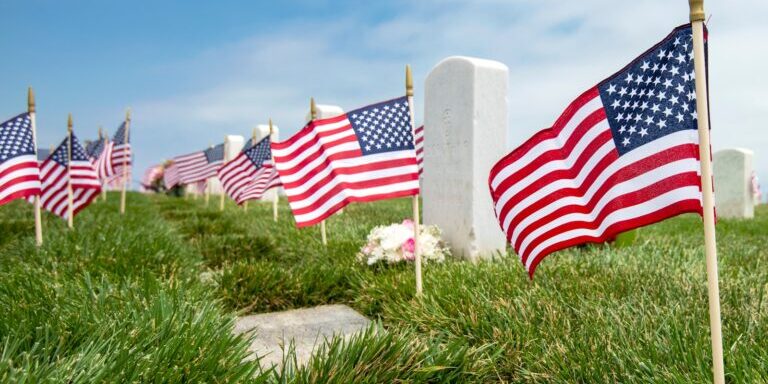 us a flag on green grass field
