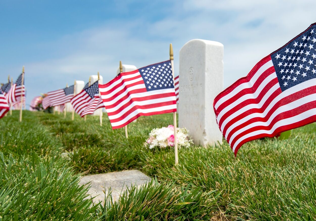 us a flag on green grass field