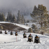 Guided snowmobile tour along Firehole River Guided snowmobile tour along Firehole River