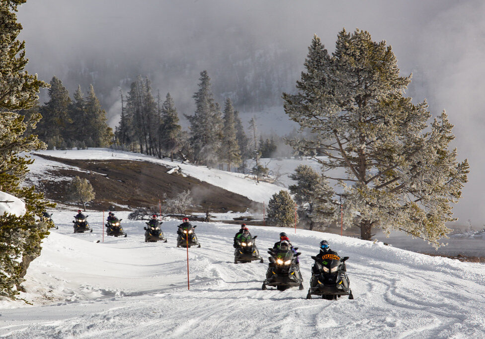 Guided snowmobile tour along Firehole River Guided snowmobile tour along Firehole River