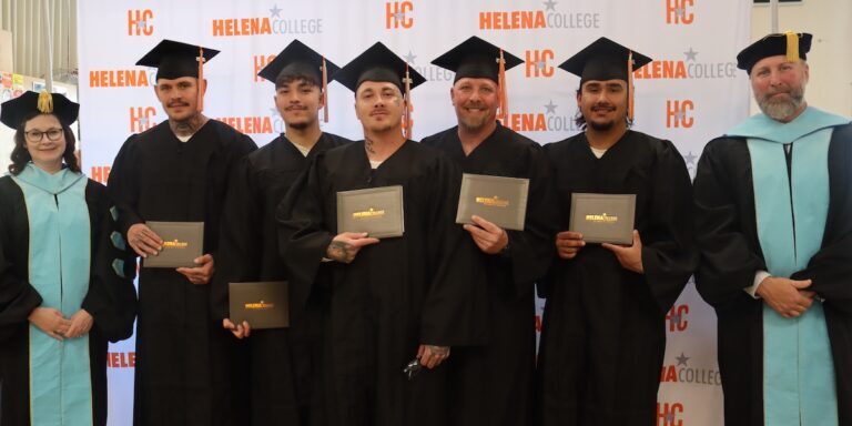 New Beginnings: Inmate students proudly display their diplomas at the third automotive technology graduation ceremony at Montana State Prison, marking a significant step towards skilled employment and successful reintegration.