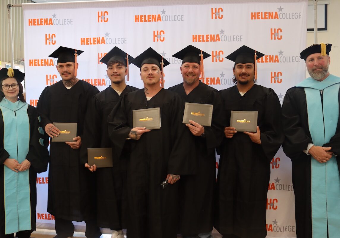 New Beginnings: Inmate students proudly display their diplomas at the third automotive technology graduation ceremony at Montana State Prison, marking a significant step towards skilled employment and successful reintegration.