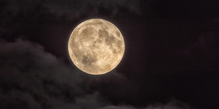 Full Moon Illuminating a Cloudy Night Sky