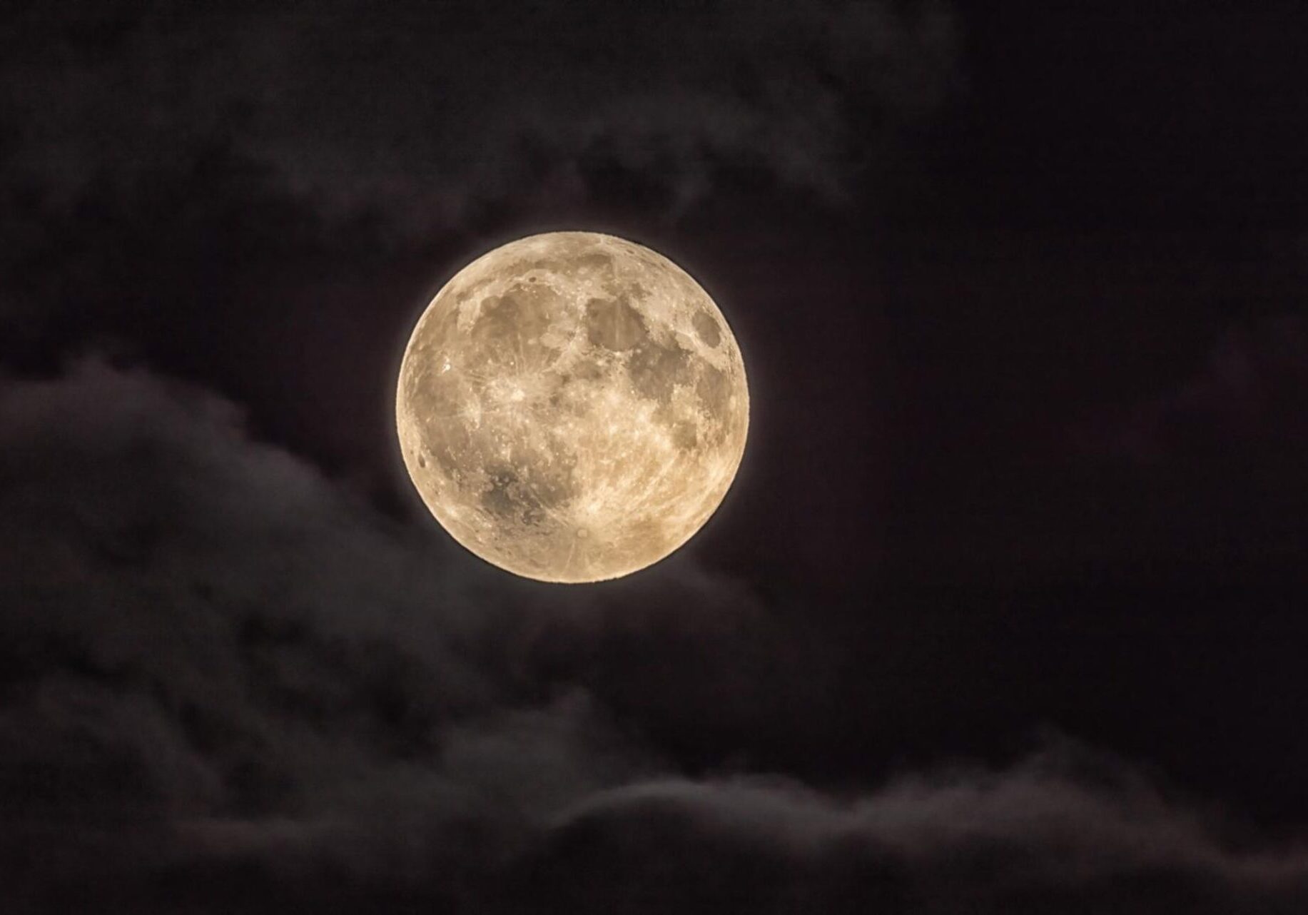 Full Moon Illuminating a Cloudy Night Sky