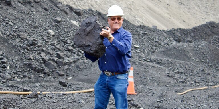 Rep. Troy Downing holds a large piece of coal during a visit to a Montana mine. (Courtesy photo)