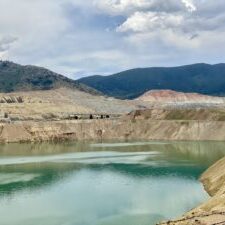 Open Pit Mine with Tailings Pond and Surrounding Hills Open Pit Mine with Tailings Pond and Surrounding Hills