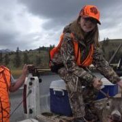 Hunting Success: Father and Daughter with Deer
