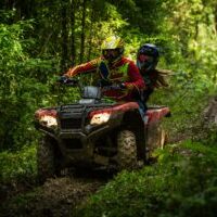 Photo by Elievan Junior man and woman riding on ATV