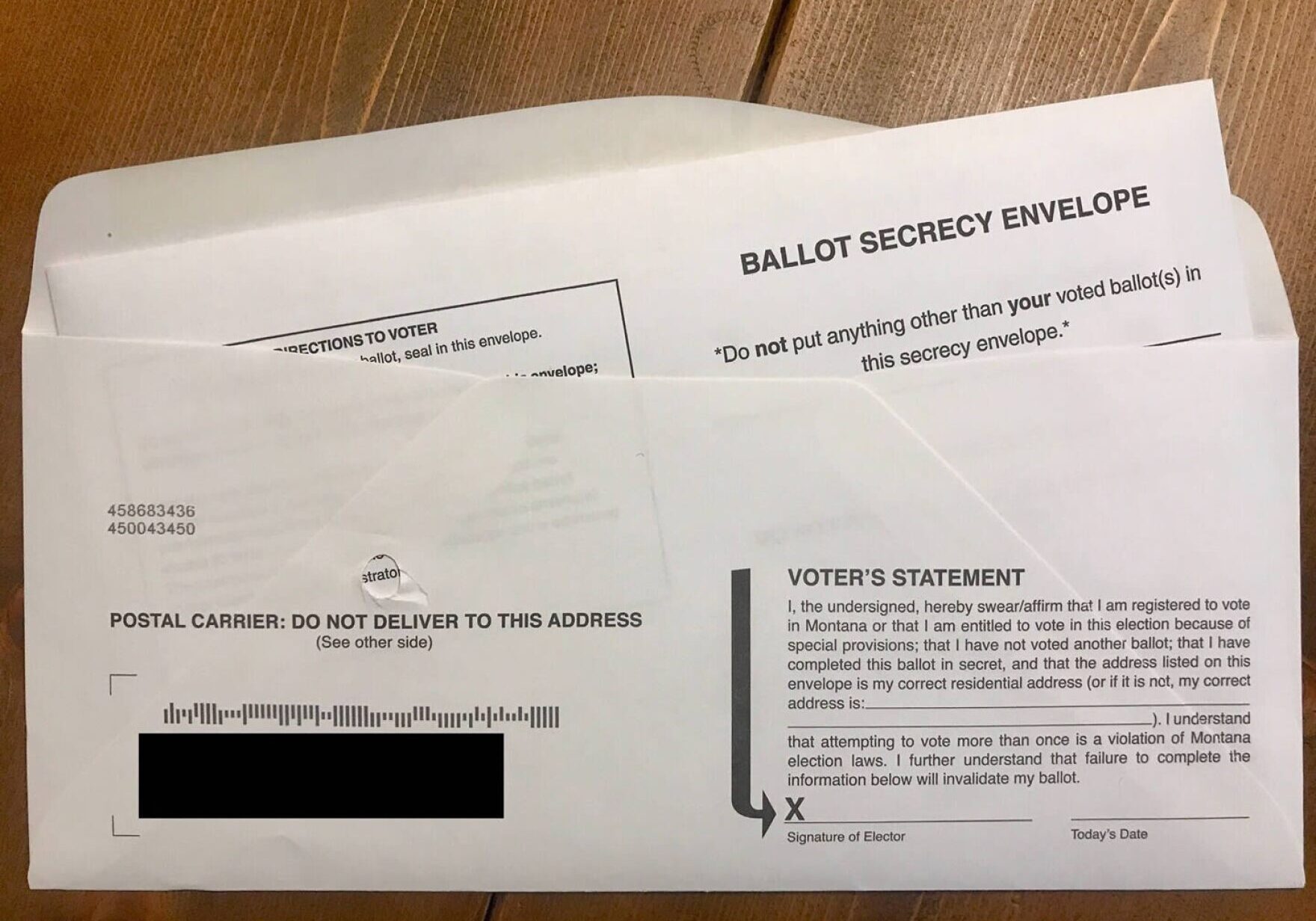 Every mail-in ballot must be placed inside of a signed ballot signature envelope. The signature on the envelope is checked against the voters registration application to verify the voters identity.