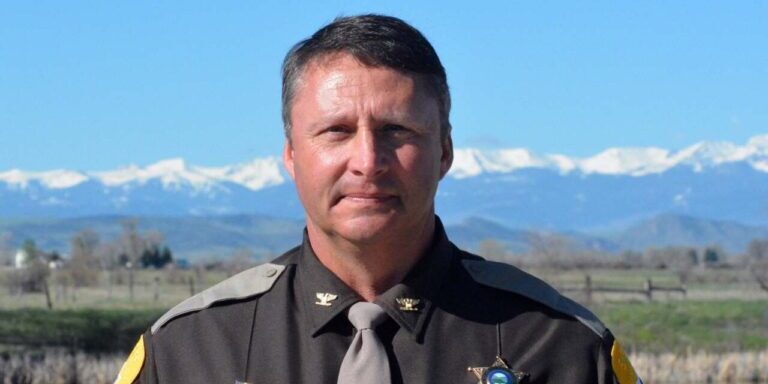 Sheriff Portrait with Mountain Backdrop