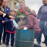 Families Burn Masks outside of Idaho Capitol Steps Families Burn Masks outside of Idaho Capitol Steps. March 6, 2021.