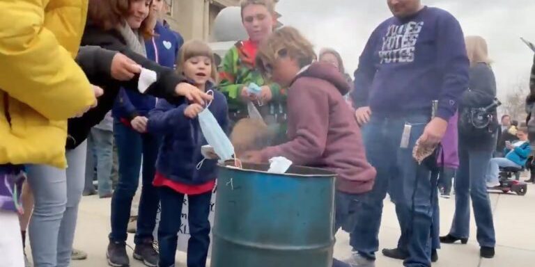 Families Burn Masks outside of Idaho Capitol Steps. March 6, 2021.