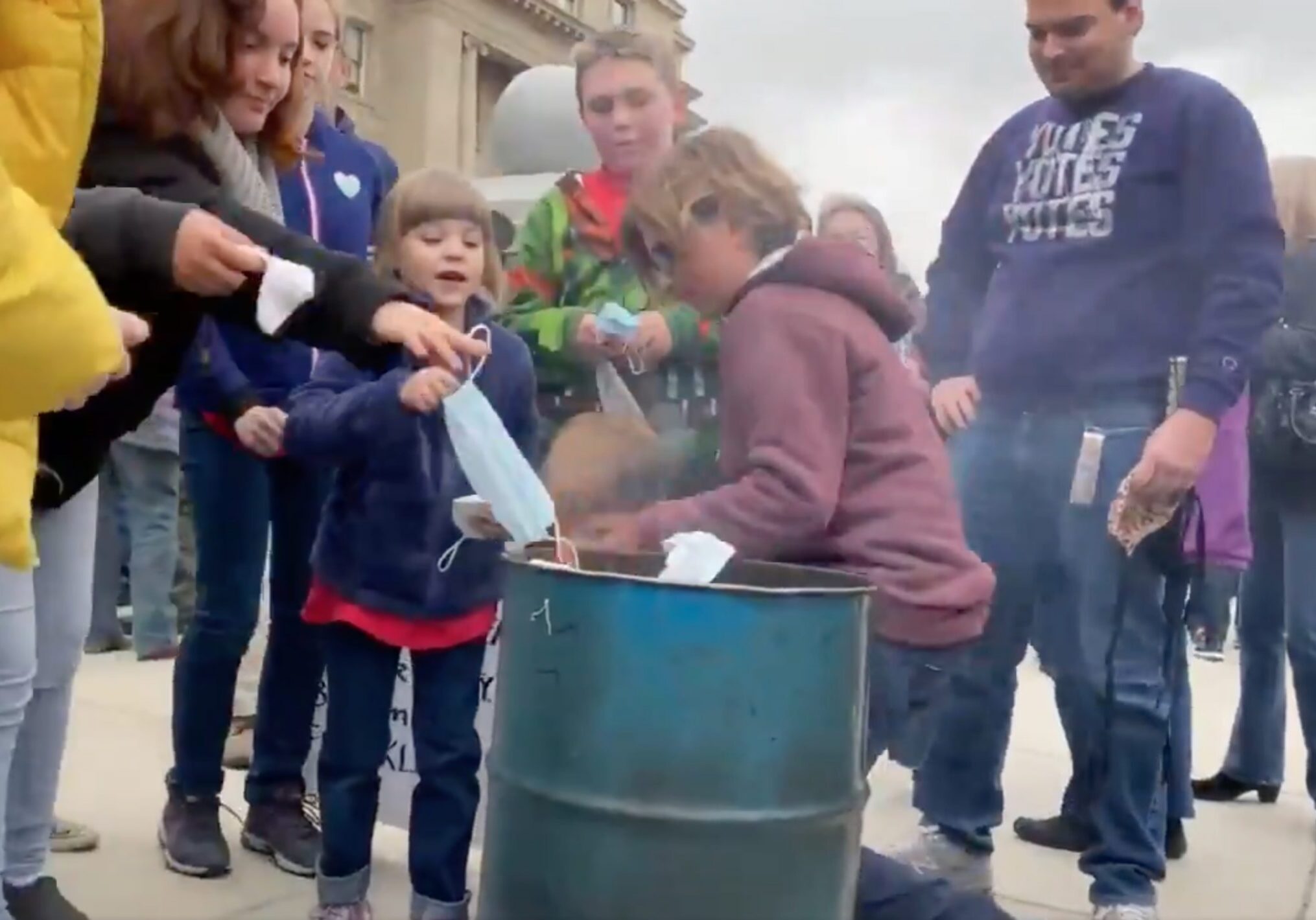 Families Burn Masks outside of Idaho Capitol Steps. March 6, 2021.
