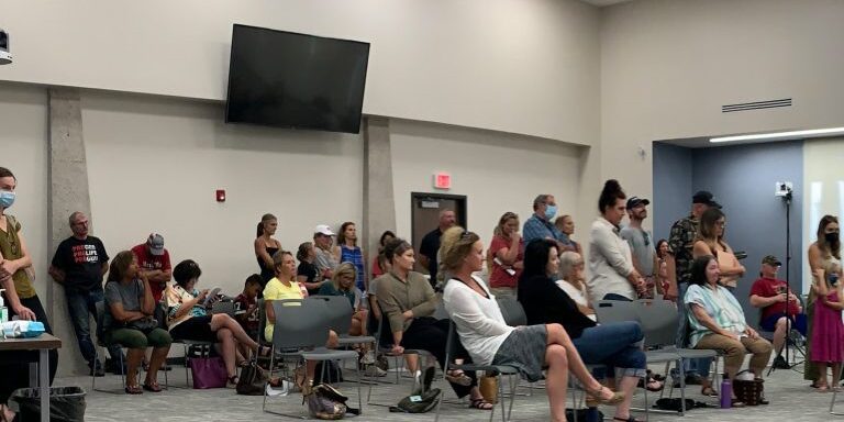 Parents stand for public comment during Missoula County Public Schools "COVID Task Force" meeting.