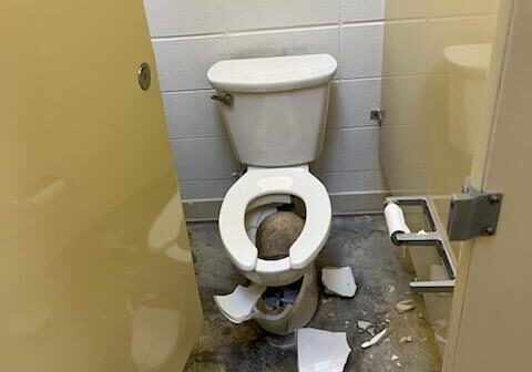 Broken Toilet in Bathroom Stall Broken Toilet in Bathroom Stall