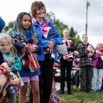 Flag Day Missoula 2020 Nora Kappelman, 5, left, and sister Sophia Kappelman, 9, wait in line to dispose of unserviceable flags during an American Legion Post 27 ceremony on Flag Day in Missoula, MT 2020. Photo by Tommy Martino/The American Legion