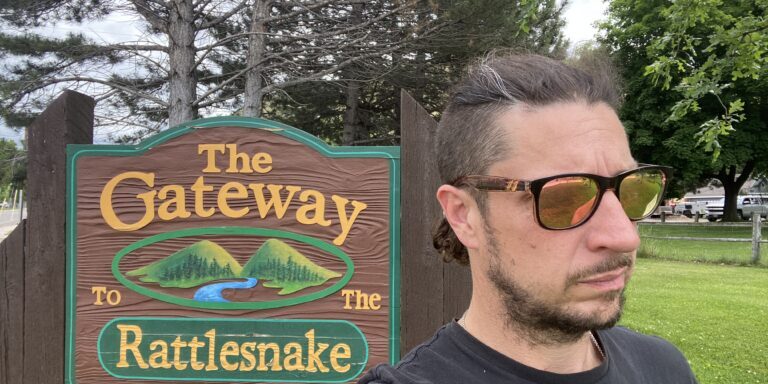 Sign in Sergeant Don Gregory Park that reads, "The Gateway To The Rattlesnake".