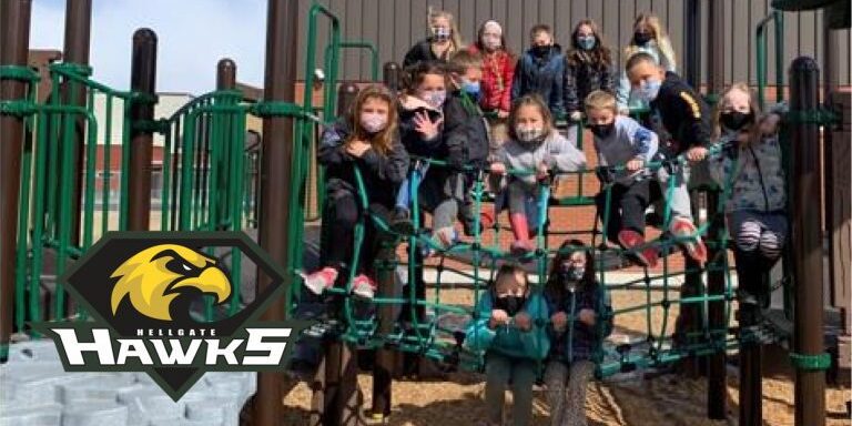 Hellgate Elementary School students pose for photo wearing masks outside. Hellgate Elementary Website.