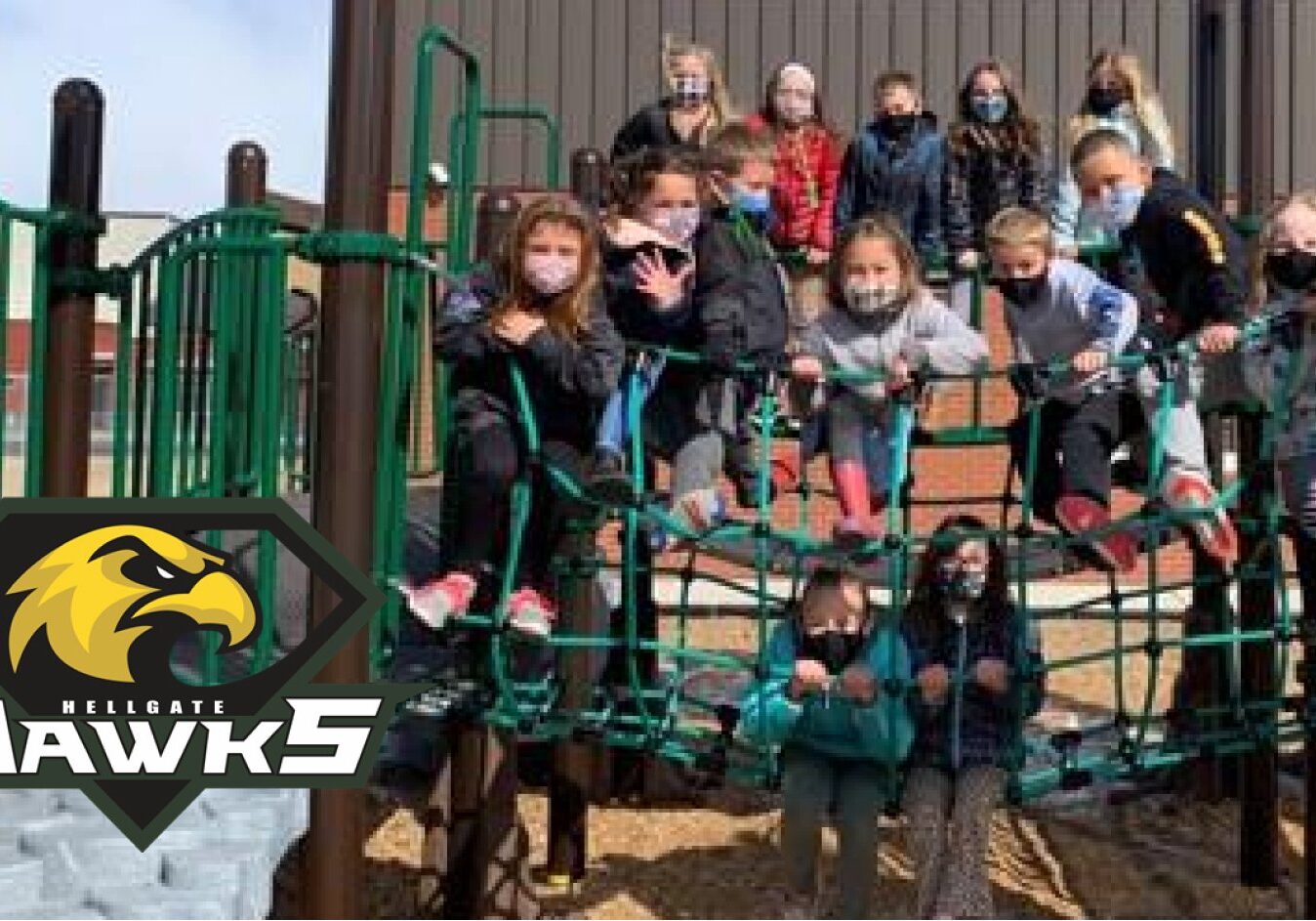 Hellgate Elementary School students pose for photo wearing masks outside. Hellgate Elementary Website.