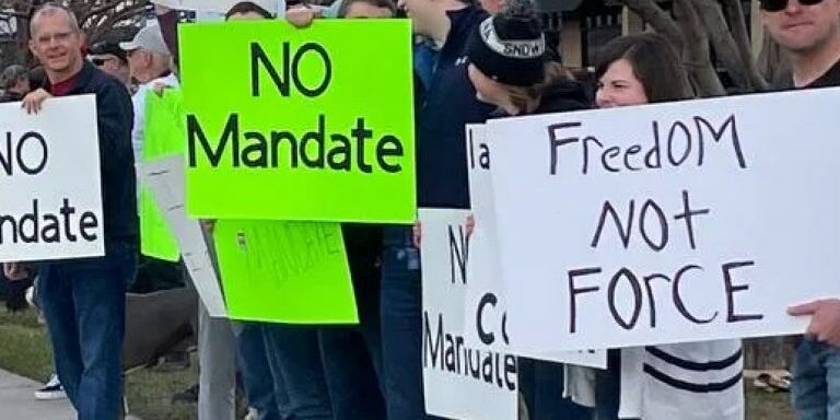 Missoulians lined up in support of healthcare workers at a rally against vaccine mandates on North Reserve Street Saturday, November 28, 2021.