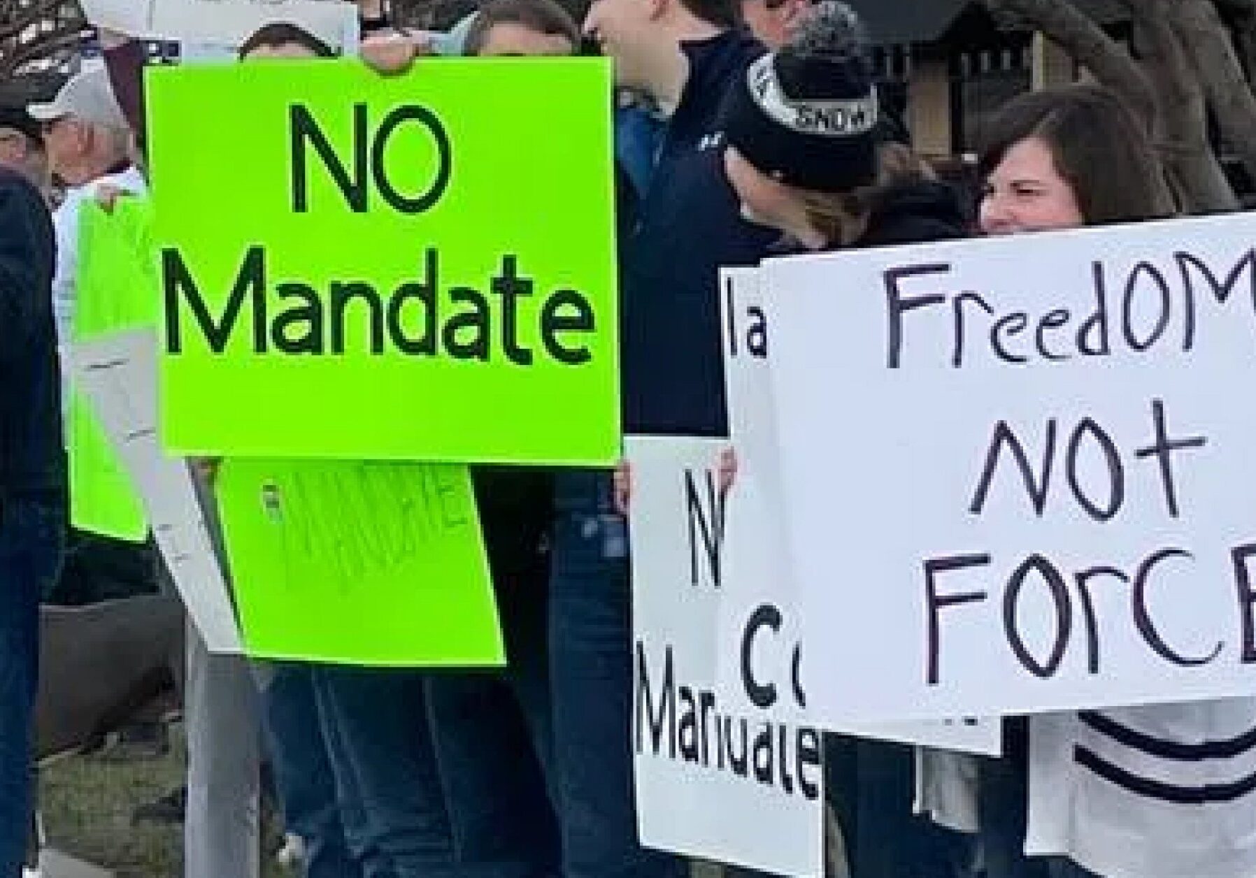Missoulians lined up in support of healthcare workers at a rally against vaccine mandates on North Reserve Street Saturday, November 28, 2021.