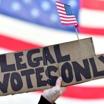 A GOP voter holds a placard reading "legal votes only" outside a ballot counting center in Philadelphia on November 8, 2020. A GOP voter holds a placard reading "legal votes only" outside a ballot counting center in Philadelphia on November 8, 2020.