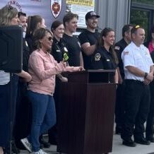 Safe Haven Baby Boxes Founder and CEO Monica Kelsey stands with Lockwood Fire Hall Chief Brandon Stevens and crew after announcing the first of several baby boxes to be installed and maintained across Montana Safe Haven Baby Boxes Founder and CEO Monica Kelsey stands with Lockwood Fire Hall Chief Brandon Stevens and crew after announcing the first of several baby boxes to be installed and maintained across Montana