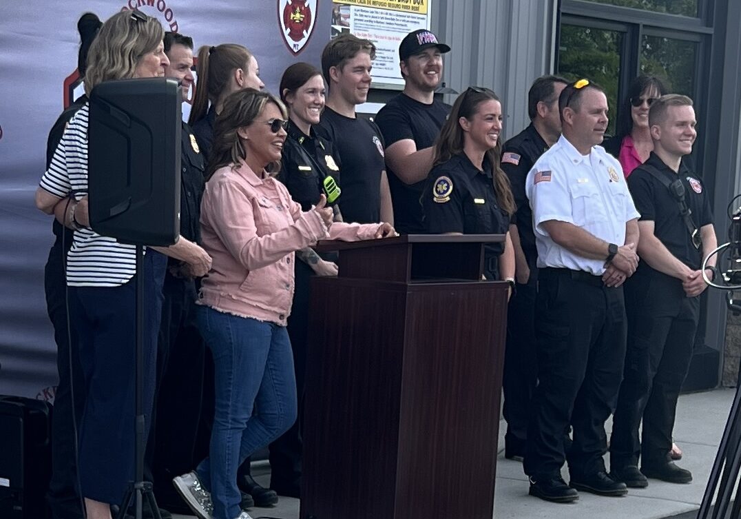 Safe Haven Baby Boxes Founder and CEO Monica Kelsey stands with Lockwood Fire Hall Chief Brandon Stevens and crew after announcing the first of several baby boxes to be installed and maintained across Montana Safe Haven Baby Boxes Founder and CEO Monica Kelsey stands with Lockwood Fire Hall Chief Brandon Stevens and crew after announcing the first of several baby boxes to be installed and maintained across Montana