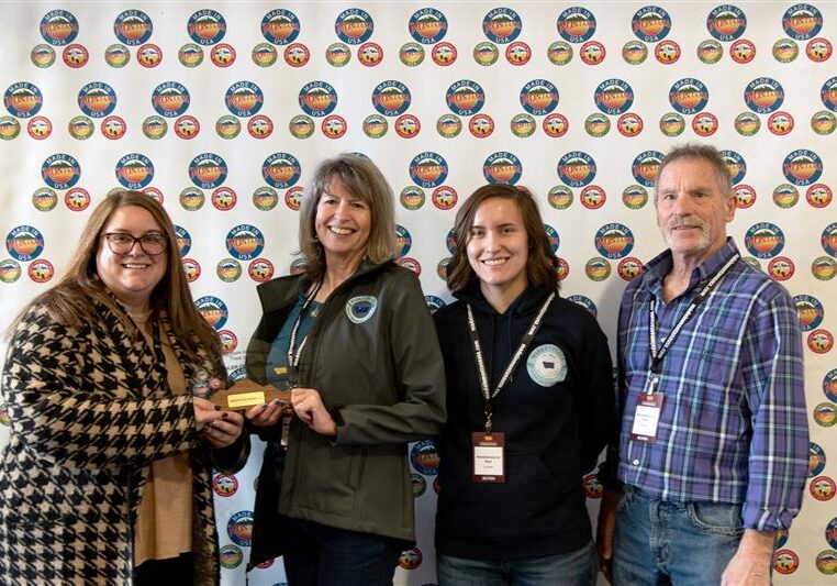 Rod and Lisa Cline, owners of Cut Bank Marketplace on Main, and store manager Jacey Hannon win the 2025 Retailer of the Year Award at the Made in Montana Trade Show in Helena.