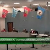 Indigenous National flags hang over Missoula school board trustees during their April 26, 2022 meeting. Indigenous National flags hang over Missoula school board trustees during their April 26, 2022 meeting.