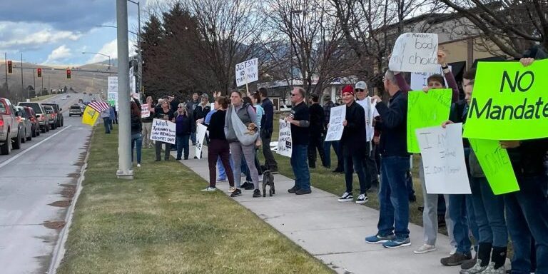 Missoulians lined up in support of healthcare workers at a rally against vaccine mandates on North Reserve Street.